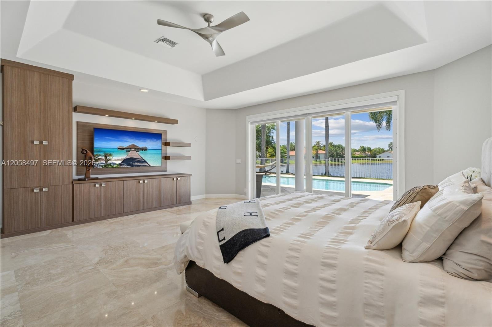 Primary bedroom opening to the pool