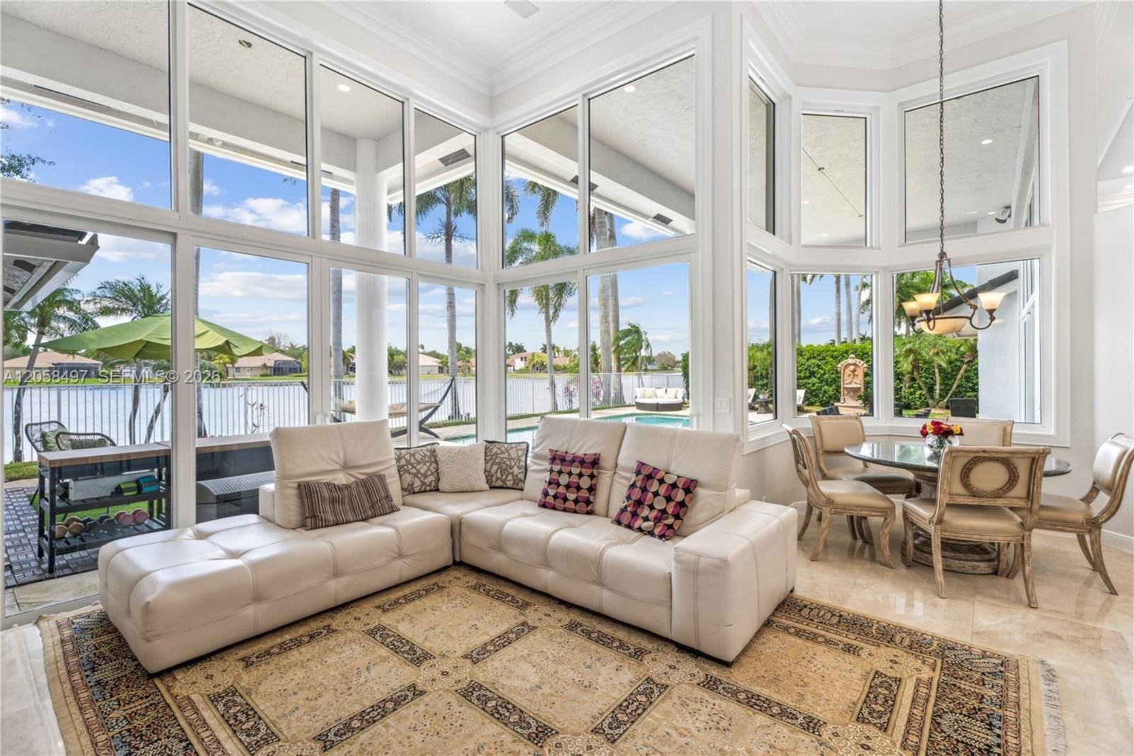 Living room with window walls facing the lake